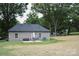 Backyard view with a patio set and well-maintained lawn at 604 E Ohio Ave, Bessemer City, NC 28016