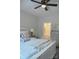 Charming bedroom with a ceiling fan and stylish furnishings that lead to a bathroom at 604 E Ohio Ave, Bessemer City, NC 28016