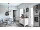 Cozy dining area with stylish decor and an adjacent, bright kitchen at 604 E Ohio Ave, Bessemer City, NC 28016
