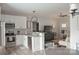 Open concept kitchen with modern appliances, white cabinets, and eat in bar at 604 E Ohio Ave, Bessemer City, NC 28016
