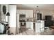 Bright kitchen features stainless steel appliances and white cabinets with bar stool seating at 604 E Ohio Ave, Bessemer City, NC 28016