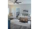 Inviting living room with a ceiling fan, neutral tones, and comfortable seating arrangements at 604 E Ohio Ave, Bessemer City, NC 28016