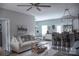 Open concept living room features neutral tones, modern decor, and ample natural light at 604 E Ohio Ave, Bessemer City, NC 28016
