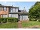 Charming townhome with gray siding, a cozy front porch, and well-maintained landscaping at 6113 Windsor Gate Ln # 6113, Charlotte, NC 28215