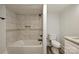 Full bathroom featuring tiled walls and shower, a tiled niche, and granite countertops at 613 E Liberty St, Salisbury, NC 28144