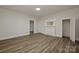 Spacious bedroom with wood-look floors, natural light, and a classic fireplace at 613 E Liberty St, Salisbury, NC 28144
