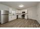 Modern kitchen featuring stainless appliances, wood-look floors and white subway tile backsplash at 613 E Liberty St, Salisbury, NC 28144