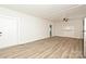 Bright living room featuring white walls, wood-look flooring, a ceiling fan, and a fireplace at 613 E Liberty St, Salisbury, NC 28144