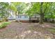 This home features a leafy backyard with a deck perfect for outdoor relaxation and entertaining at 636 Forest Nw St, Concord, NC 28025