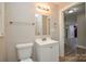 Traditional bathroom featuring a neutral color palette, with a single sink and tiled shower at 636 Forest Nw St, Concord, NC 28025