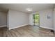 Well-lit bedroom with sliding glass doors to the outside deck at 636 Forest Nw St, Concord, NC 28025