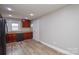 An updated kitchen with wood cabinets, granite countertops, and updated appliances features modern flooring at 636 Forest Nw St, Concord, NC 28025