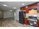 A spacious kitchen featuring wood-look flooring, stainless appliances, and lots of natural light at 636 Forest Nw St, Concord, NC 28025