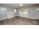 Bright living room with a decorative fireplace and large windows that let in plenty of natural light at 636 Forest Nw St, Concord, NC 28025