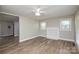 Open-concept living room with fireplace, and neutral paint at 636 Forest Nw St, Concord, NC 28025