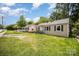 One-story home with a front porch and dark shutters, with some damage visible at 638 E Black St, Rock Hill, SC 29730