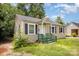 One-story home featuring a white front door and dark shutters, set on a large lot at 638 E Black St, Rock Hill, SC 29730