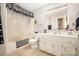 Bright bathroom with shower-tub combination, framed mirror, and white vanity at 713 Hickory Hill Ct, Gastonia, NC 28054
