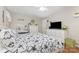 Bedroom featuring hardwood floors, white furnishings, decorative wall art and natural lighting at 713 Hickory Hill Ct, Gastonia, NC 28054