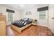 Modern bedroom with hardwood floors, modern decor, and lots of natural light at 713 Hickory Hill Ct, Gastonia, NC 28054