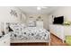 Bedroom featuring hardwood floors, white furnishings, and decorative wall art at 713 Hickory Hill Ct, Gastonia, NC 28054