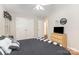 Bedroom featuring hardwood floors, closet space, and contemporary furnishings at 713 Hickory Hill Ct, Gastonia, NC 28054