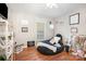 Bright and airy bedroom featuring a beanbag chair, hardwood floors, and a well-lit area at 713 Hickory Hill Ct, Gastonia, NC 28054