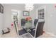 Bright dining area featuring a glass table with seating for four and modern décor at 713 Hickory Hill Ct, Gastonia, NC 28054