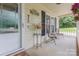 Cozy front porch area with chairs, plants, and decorative touches for a welcoming feel at 713 Hickory Hill Ct, Gastonia, NC 28054