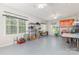 Spacious garage with storage shelves, windows, and two ceiling fans at 713 Hickory Hill Ct, Gastonia, NC 28054