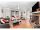 Inviting living room featuring a brick fireplace, hardwood floors, and modern decor accents at 713 Hickory Hill Ct, Gastonia, NC 28054