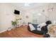 Bright living room featuring hardwood floors, a ceiling fan, and a cozy beanbag style chair at 713 Hickory Hill Ct, Gastonia, NC 28054