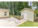 Backyard with fenced area that contains a shed and an out-building at 713 Hickory Hill Ct, Gastonia, NC 28054