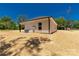 View of the backyard of a newly constructed home with beige siding and a well-manicured lawn at 812 Generation Ln, Clover, SC 29710
