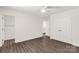Bright bedroom featuring wood-look floors, ceiling fan, and double door closet at 812 Generation Ln, Clover, SC 29710