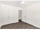 Bedroom featuring wood-look floors, ceiling fan, and double door closet at 812 Generation Ln, Clover, SC 29710