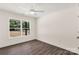 Bedroom featuring wood-look floors and window overlooking a spacious backyard at 812 Generation Ln, Clover, SC 29710