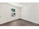 Bedroom featuring wood-look floors and window overlooking a spacious backyard at 812 Generation Ln, Clover, SC 29710