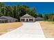 Charming home with a long driveway, showcasing a well-maintained exterior and adjacent outbuilding at 812 Generation Ln, Clover, SC 29710