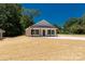 Charming single-story home featuring a modern exterior, front porch and a new lawn at 812 Generation Ln, Clover, SC 29710