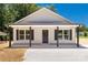 Charming single-story home with light siding, dark shutters, and a welcoming front porch at 812 Generation Ln, Clover, SC 29710