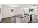 Open kitchen and living room area featuring a center island with seating and stainless steel appliances at 812 Generation Ln, Clover, SC 29710