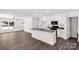 Open kitchen and living room area featuring a center island and modern finishes at 812 Generation Ln, Clover, SC 29710