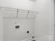 Utility room featuring white walls, hook ups, and wire shelf at 812 Generation Ln, Clover, SC 29710
