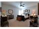 Bedroom showcasing a bed, ceiling fan, and stylish decor throughout the room at 914 Greenbridge Dr, Matthews, NC 28105