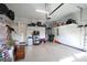 Organized garage featuring ample storage shelves, an epoxy floor, and overhead door opener at 914 Greenbridge Dr, Matthews, NC 28105