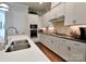 Well-equipped kitchen features stainless steel appliances, white cabinetry, and quartz countertops at 914 Greenbridge Dr, Matthews, NC 28105