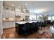 Spacious kitchen with an island, pendant lighting, stainless steel appliances, and open-concept dining area at 914 Greenbridge Dr, Matthews, NC 28105