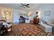 Comfortable living room showcasing hardwood floors, a ceiling fan, and classic furniture at 914 Greenbridge Dr, Matthews, NC 28105