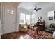 Bright living room boasting hardwood floors, a ceiling fan, natural light, and comfortable seating at 914 Greenbridge Dr, Matthews, NC 28105